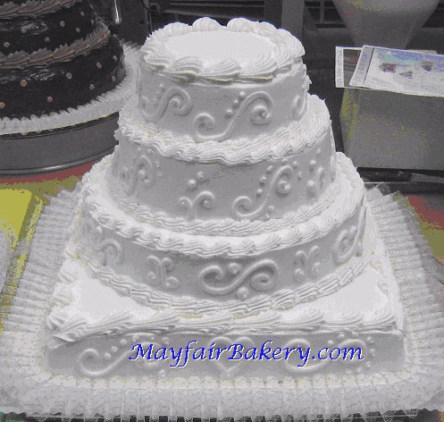 square wedding cake with round tiers