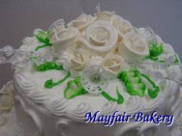 White flowers on top of wedding cake