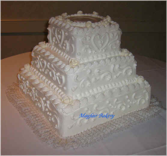 Three tier square wedding cake by Mayfair Bakery